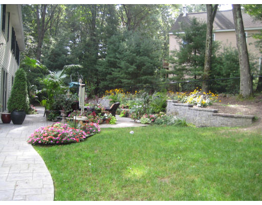 2 Abbott Road Maynard, MA 01754 - Photo 23 of 26 a table and chairs in a garden