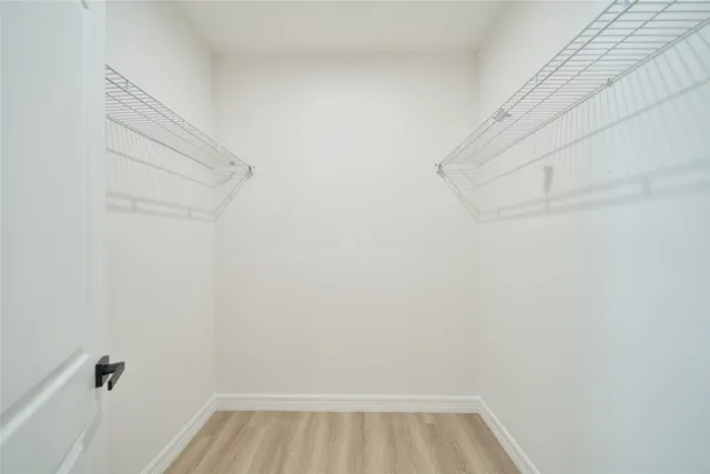 a view of a room with racks on the wall