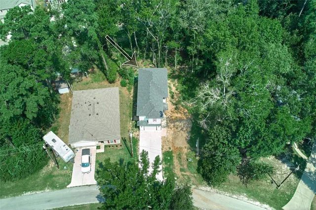 an aerial view of residential house with outdoor space