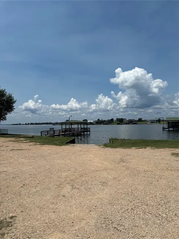 a view of a water fountain and a big yard