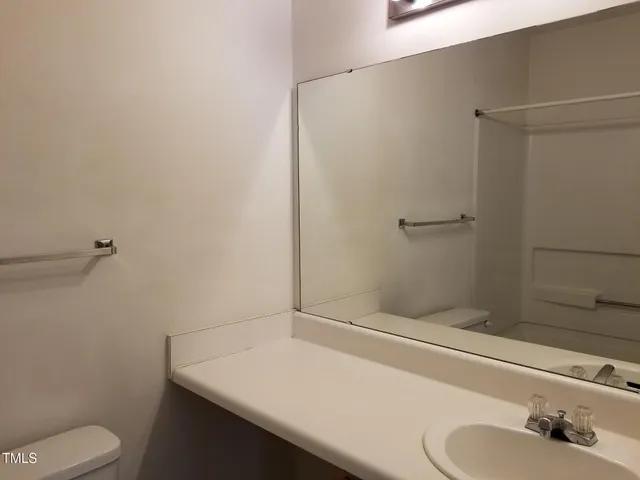 a bathroom with a sink toilet and vanity