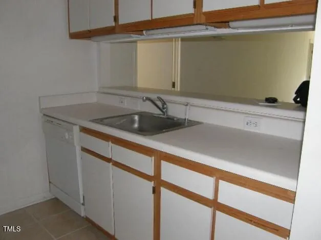 a close view of a stove top oven and cabinets