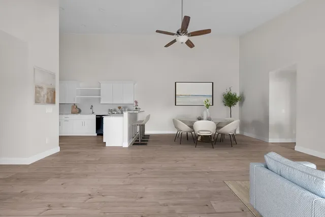 a living room with furniture and white walls