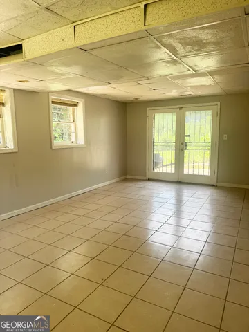 a view of an empty room and a window