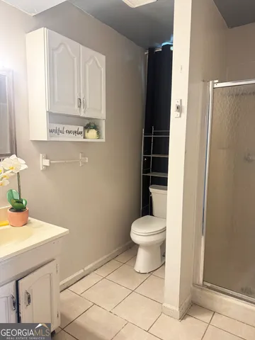 a bathroom with a toilet a sink and vanity