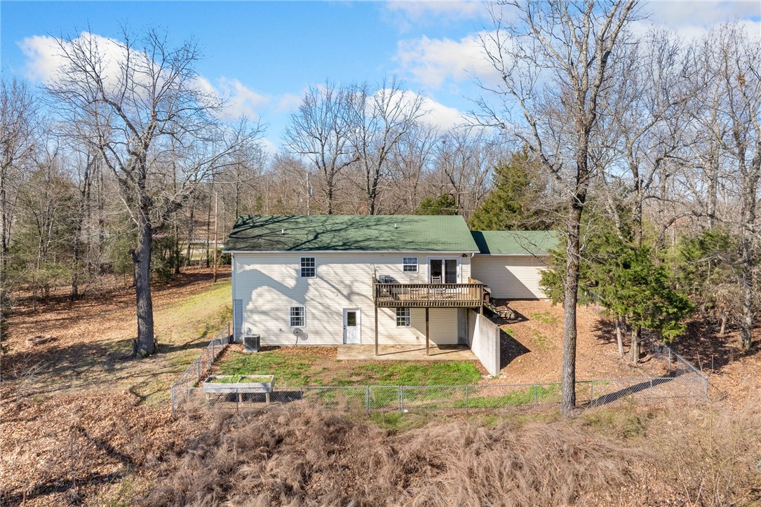 Rear view of property with a wooden deck