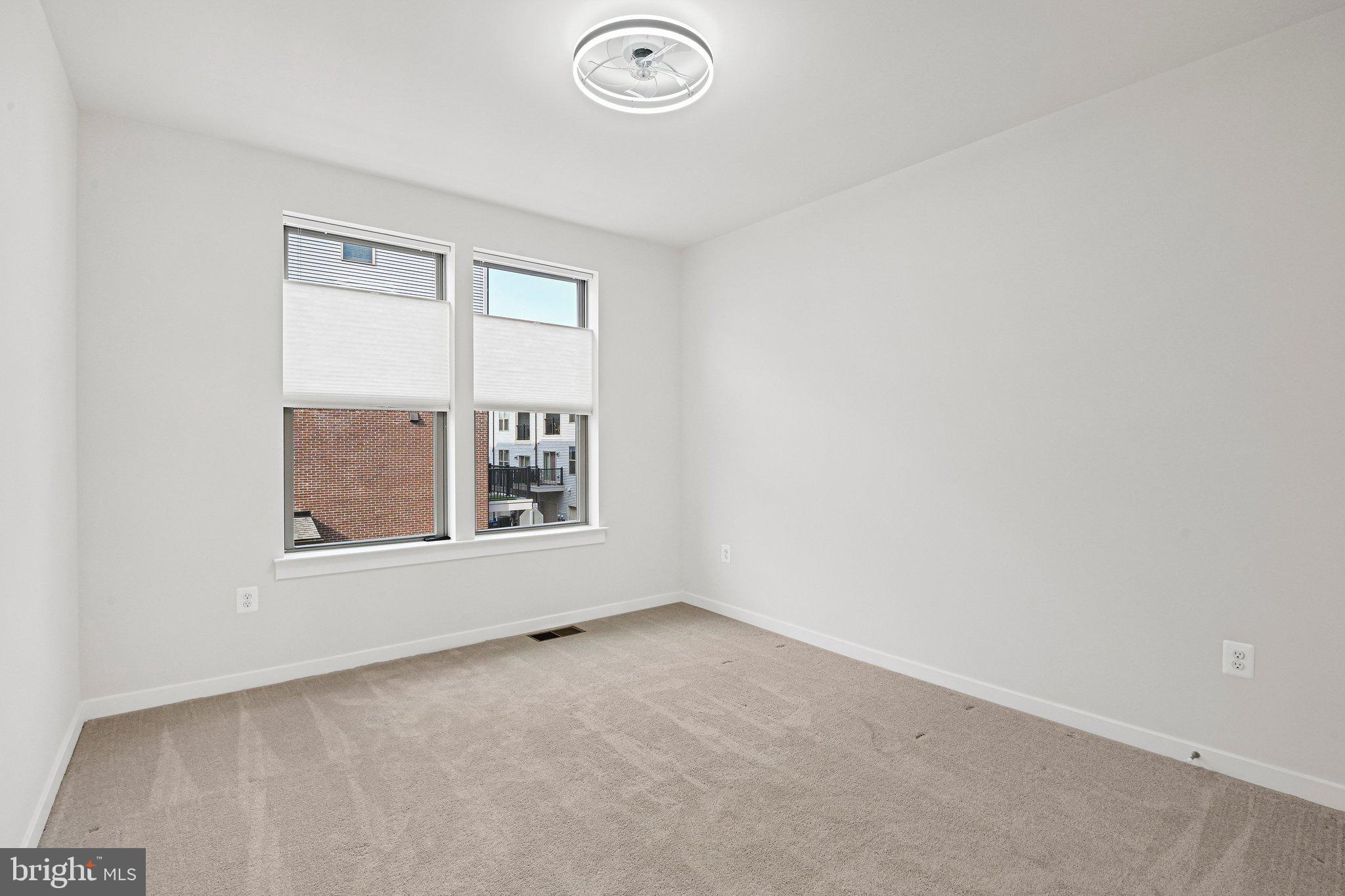 13556 Innovation Station Loop, Unit 15A Herndon, VA 20171 - Photo 11 of 28 an empty room with a window