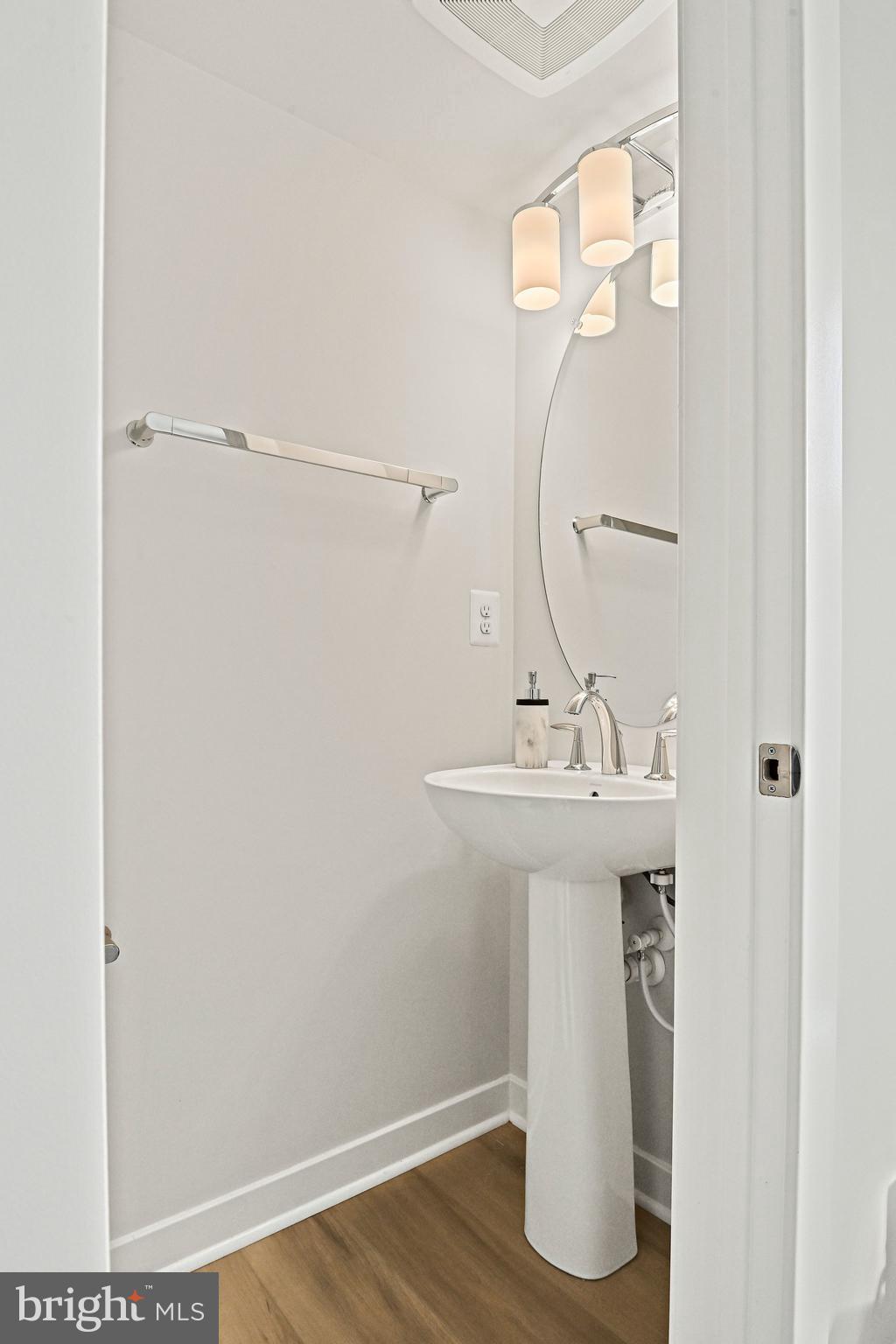 13556 Innovation Station Loop, Unit 15A Herndon, VA 20171 - Photo 14 of 28 a bathroom with a sink a mirror and a shower