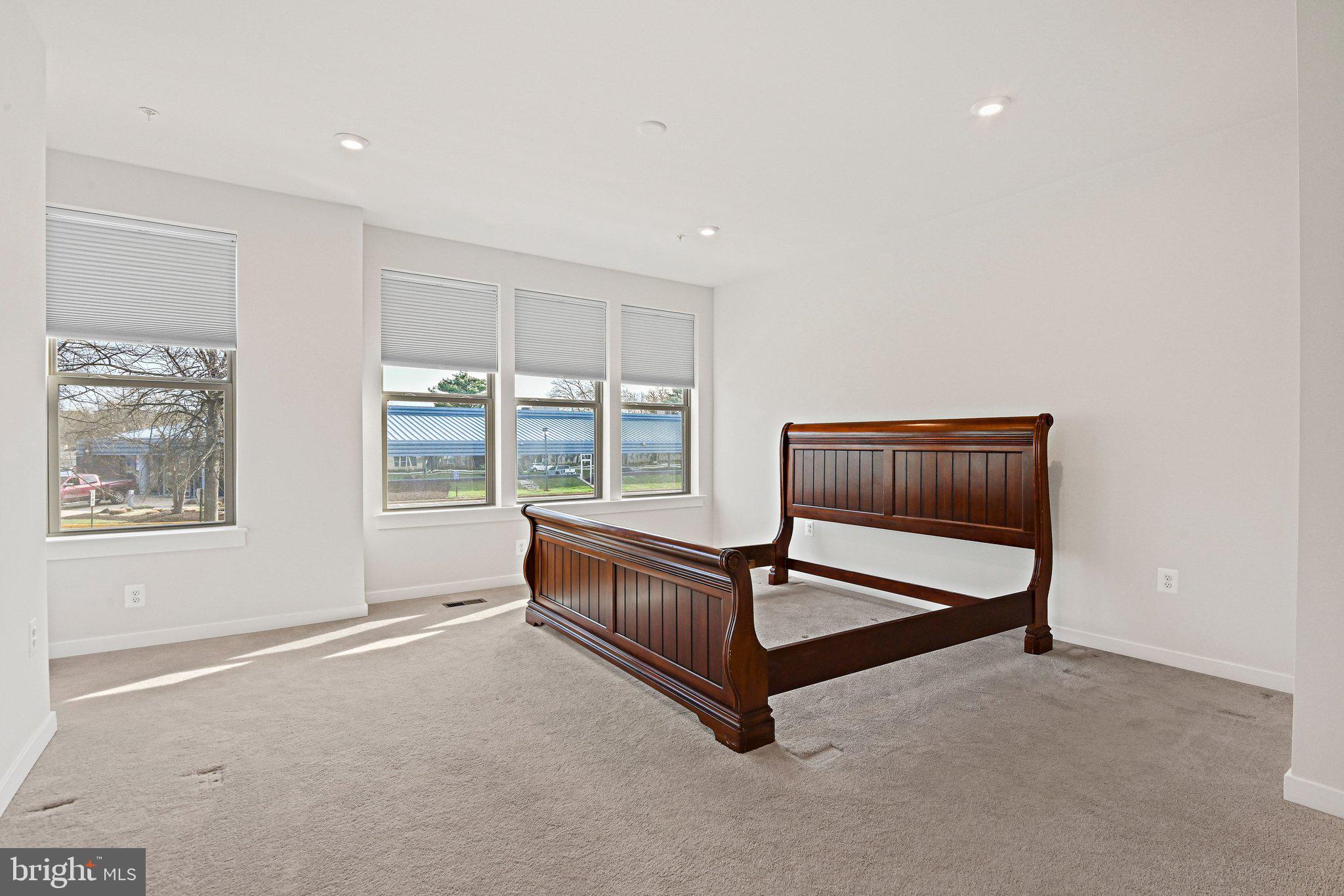 13556 Innovation Station Loop, Unit 15A Herndon, VA 20171 - Photo 18 of 28 a living room with furniture and a window