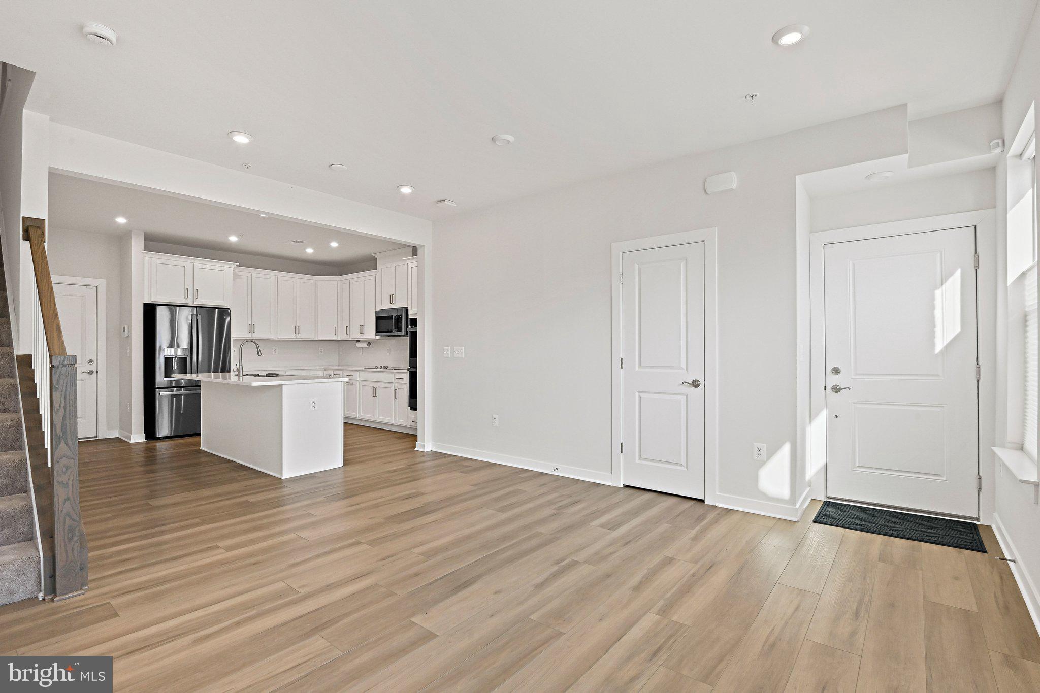 13556 Innovation Station Loop, Unit 15A Herndon, VA 20171 - Photo 2 of 28 a view of kitchen with wooden floor