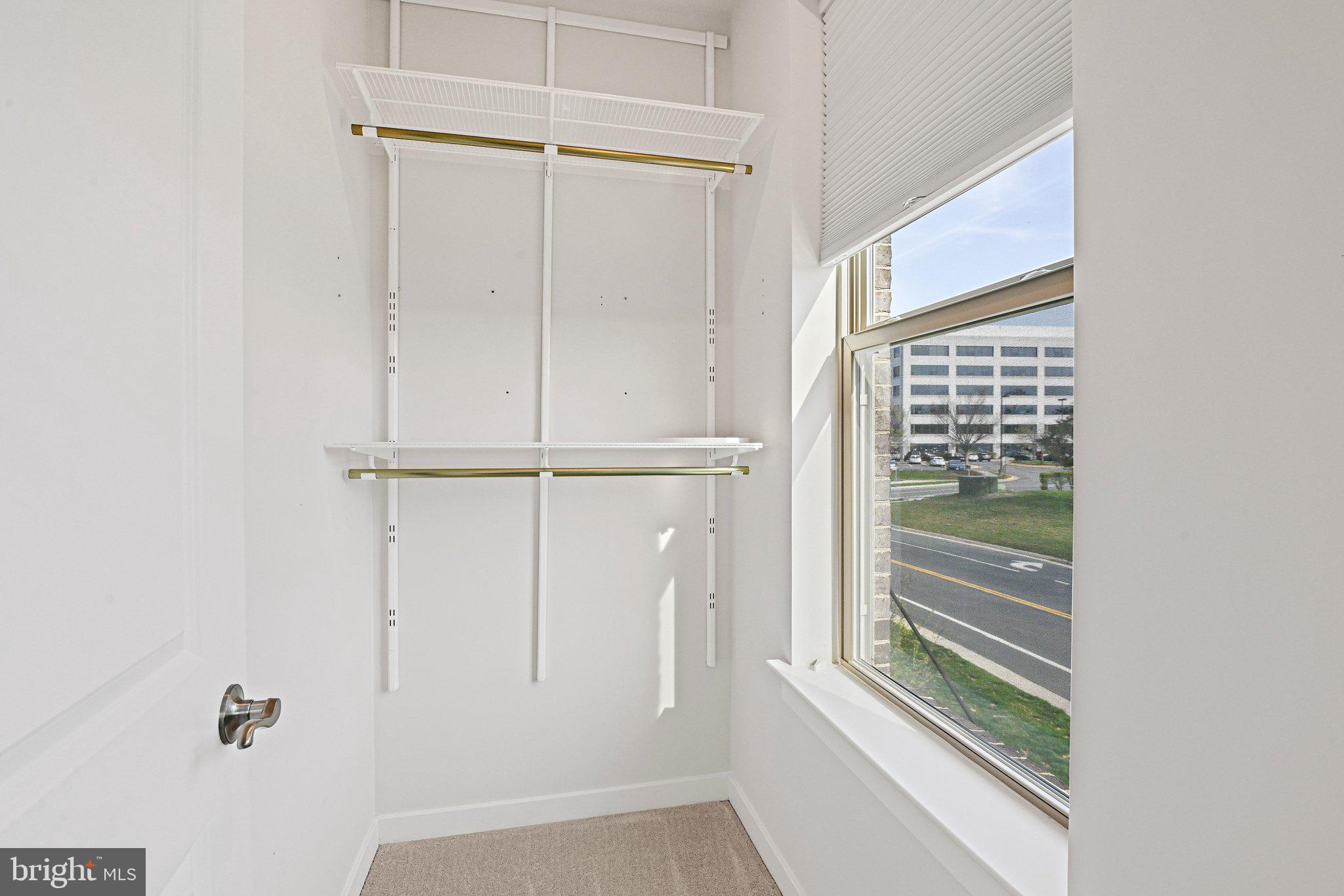 13556 Innovation Station Loop, Unit 15A Herndon, VA 20171 - Photo 21 of 28 a view of a closet area with racks