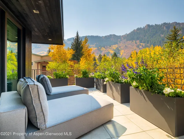 a view of balcony with furniture
