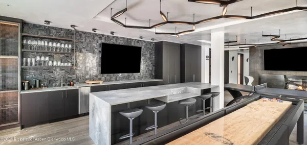 a kitchen with stainless steel appliances granite countertop a sink and a microwave