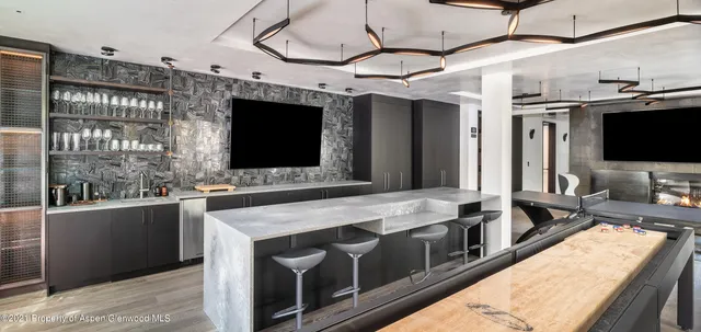 a kitchen with stainless steel appliances granite countertop a sink and a microwave