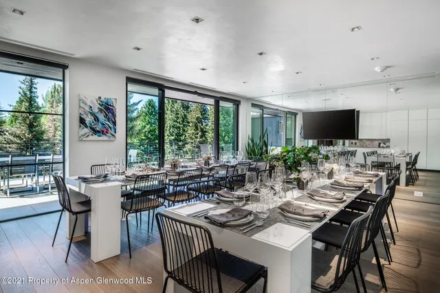 a view of a dining room with furniture window and outside view