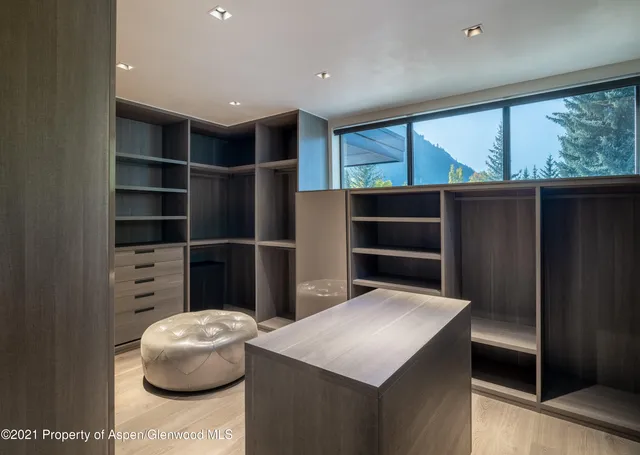 a hallway with furniture and window