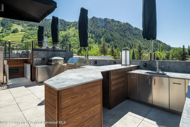 a view of kitchen with a sink and outdoor kitchen