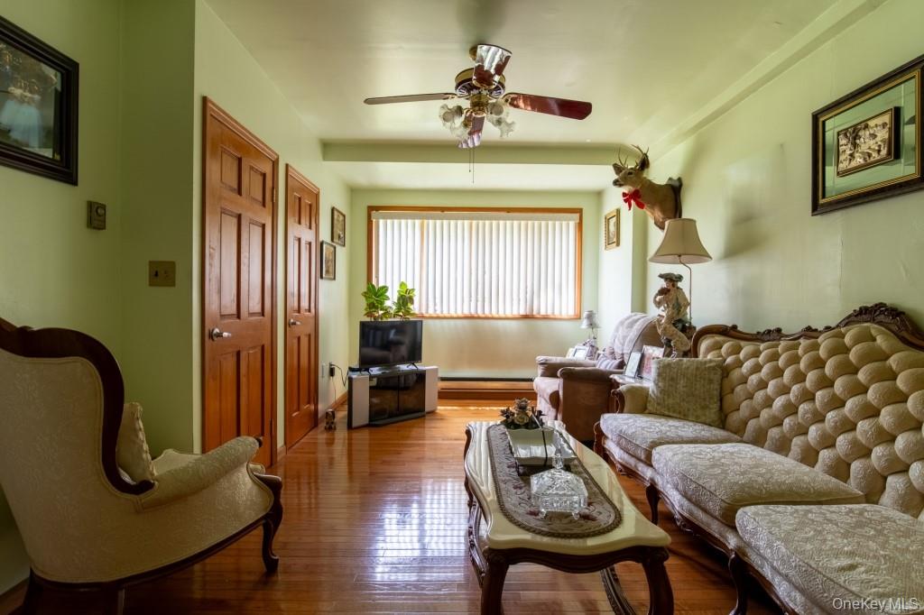 139 Haddock Road Monticello, NY 12701 - Photo 15 of 40 Living area featuring hardwood / wood-style floors and ceiling fan