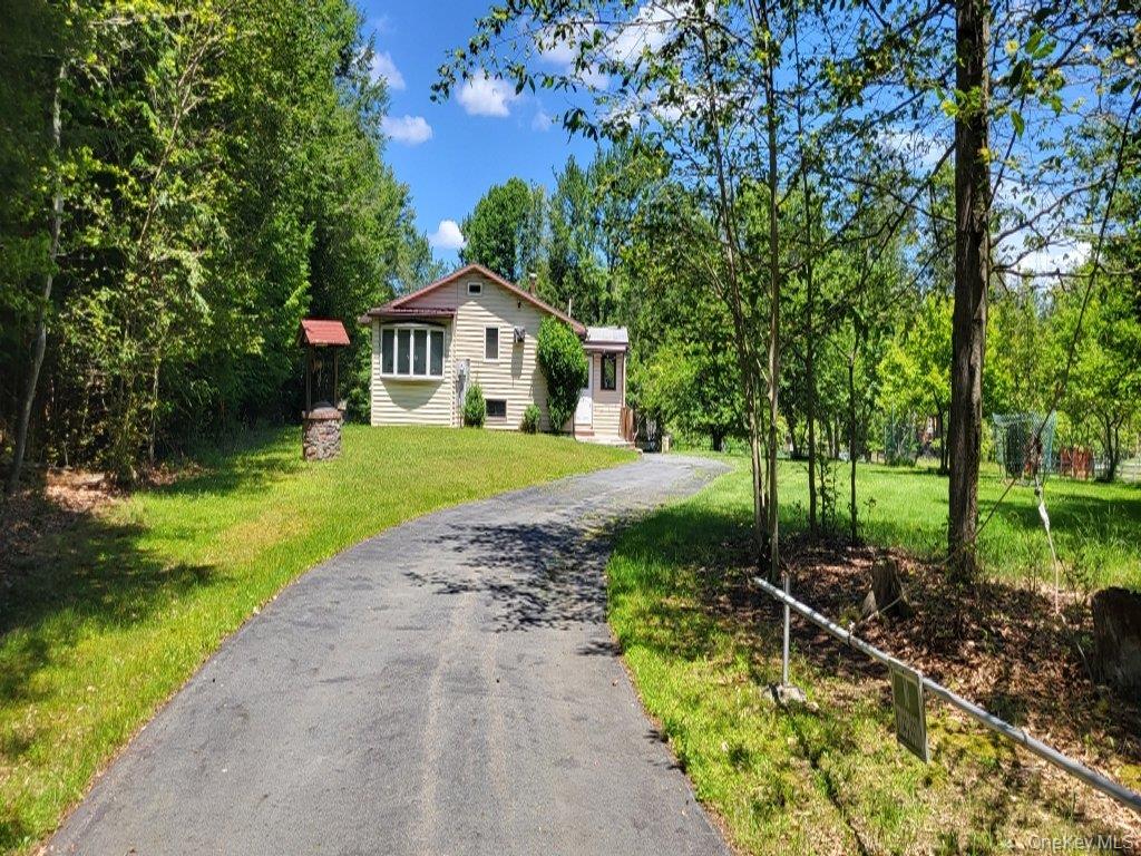 139 Haddock Road Monticello, NY 12701 - Photo 2 of 40 View of front facade with driveway and a front yard