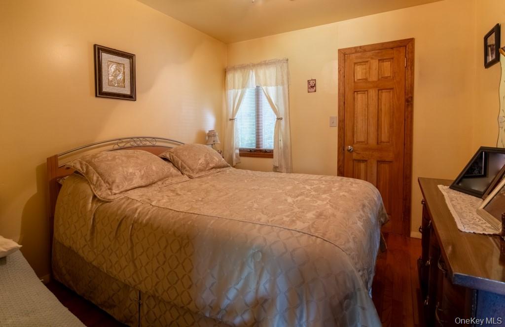 139 Haddock Road Monticello, NY 12701 - Photo 24 of 40 Bedroom featuring dark wood-type flooring