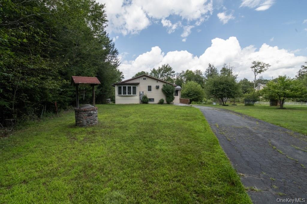 139 Haddock Road Monticello, NY 12701 - Photo 40 of 40 View of front of home with a front lawn and asphalt driveway