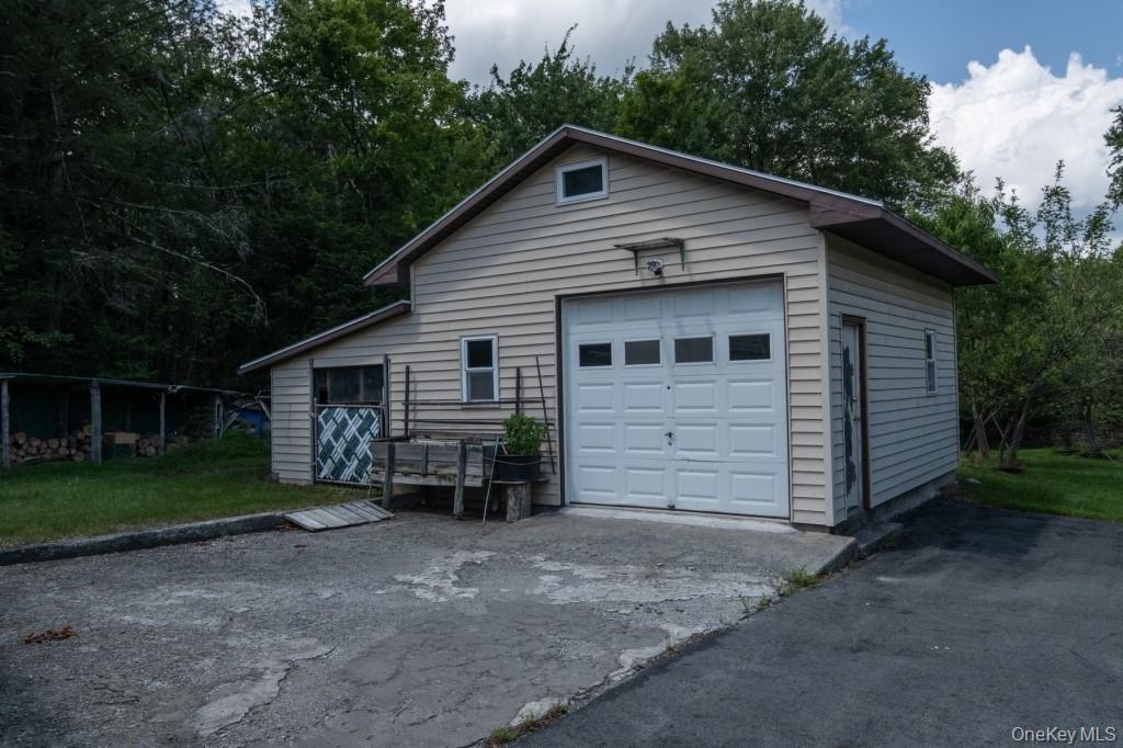 139 Haddock Road Monticello, NY 12701 - Photo 6 of 40 Garage with driveway