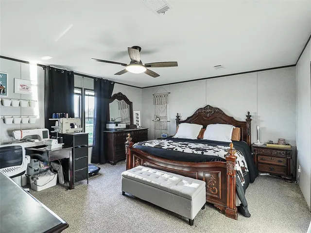 a bedroom with furniture and a window