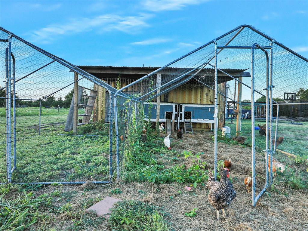 2149 Webb Smith Road Sherman, TX 75090 - Photo 25 of 39 a front view of a house with garden