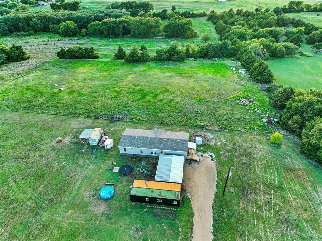 2149 Webb Smith Road Sherman, TX 75090 - Photo 30 of 39 a view of a house with a backyard porch and sitting area