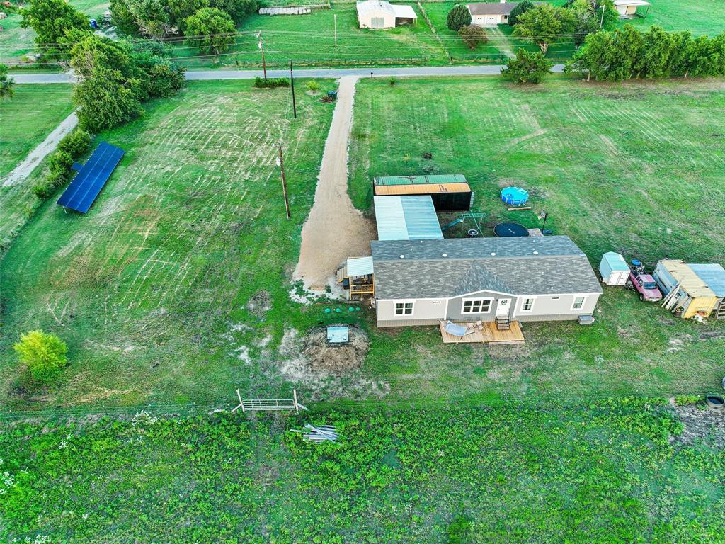 2149 Webb Smith Road Sherman, TX 75090 - Photo 32 of 39 a view of a garden with a bench sitting area
