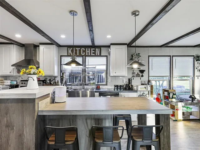 a kitchen with a table and chairs in it