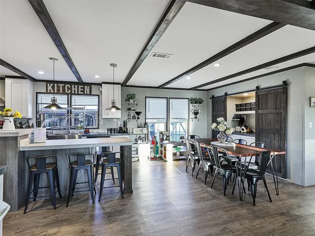 a view of a dining area with furniture window and wooden floor