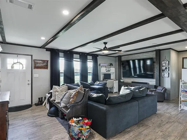 a living room with furniture and a large window