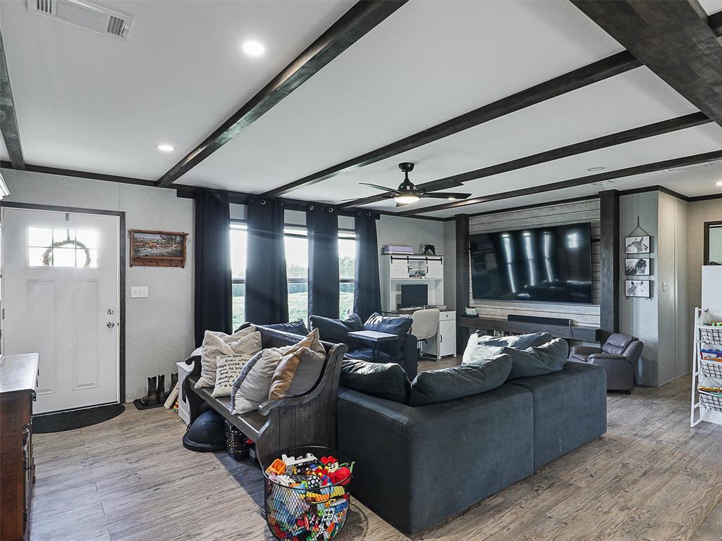 2149 Webb Smith Road Sherman, TX 75090 - Photo 10 of 39 a living room with furniture and a large window