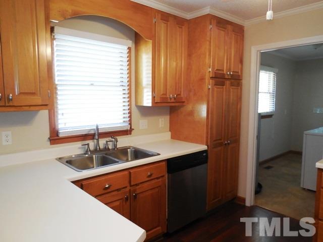 324 Microwave Tower Road Roseboro, NC 28382 - Photo 8 of 24 a kitchen with a sink and a window