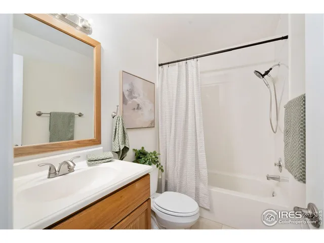 a bathroom with a sink toilet tub and shower