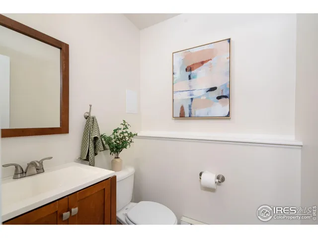a bathroom with a sink mirror and vanity