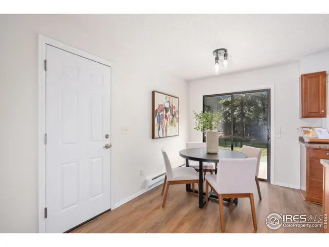 a workspace room with furniture and a window