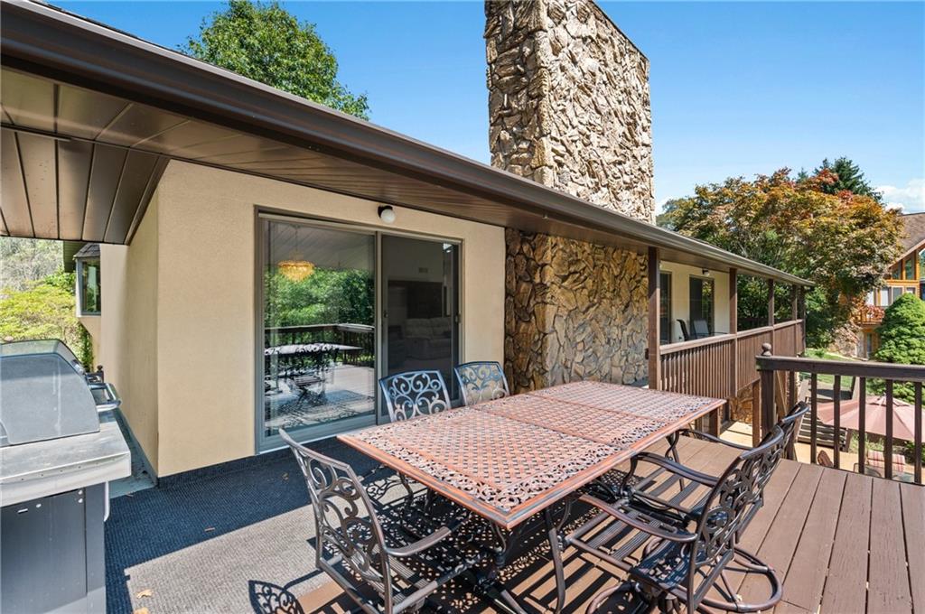 1164 River Road Freeport, PA 16229 - Photo 17 of 50 a view of a patio with table and chairs with wooden floor and fence