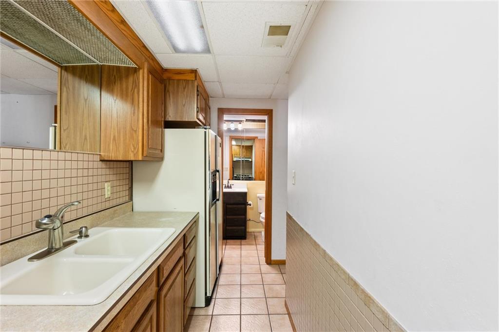 1164 River Road Freeport, PA 16229 - Photo 26 of 50 a bathroom with a sink and a large mirror