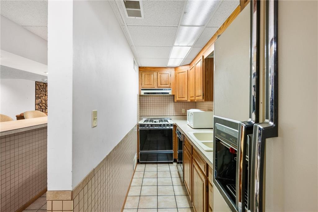 1164 River Road Freeport, PA 16229 - Photo 27 of 50 a kitchen with a sink appliances and cabinets