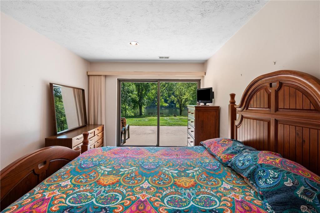 1164 River Road Freeport, PA 16229 - Photo 30 of 50 a bedroom with a bed and a large window