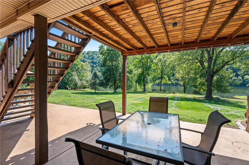 1164 River Road Freeport, PA 16229 - Photo 33 of 50 a view of a patio with a table chairs and a backyard