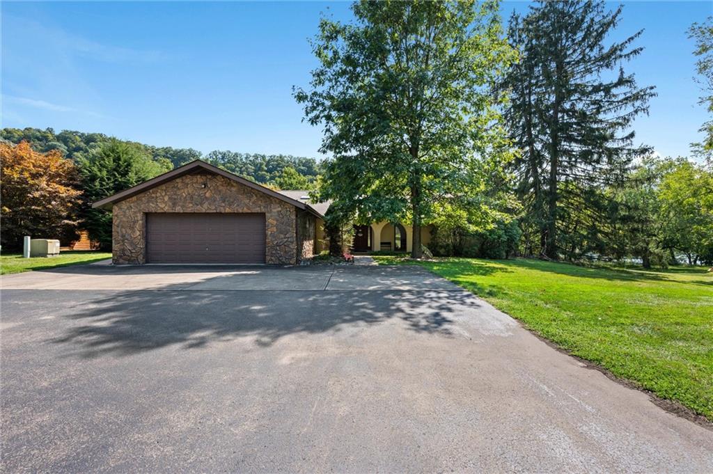 1164 River Road Freeport, PA 16229 - Photo 40 of 50 a front view of a house with a yard and garage
