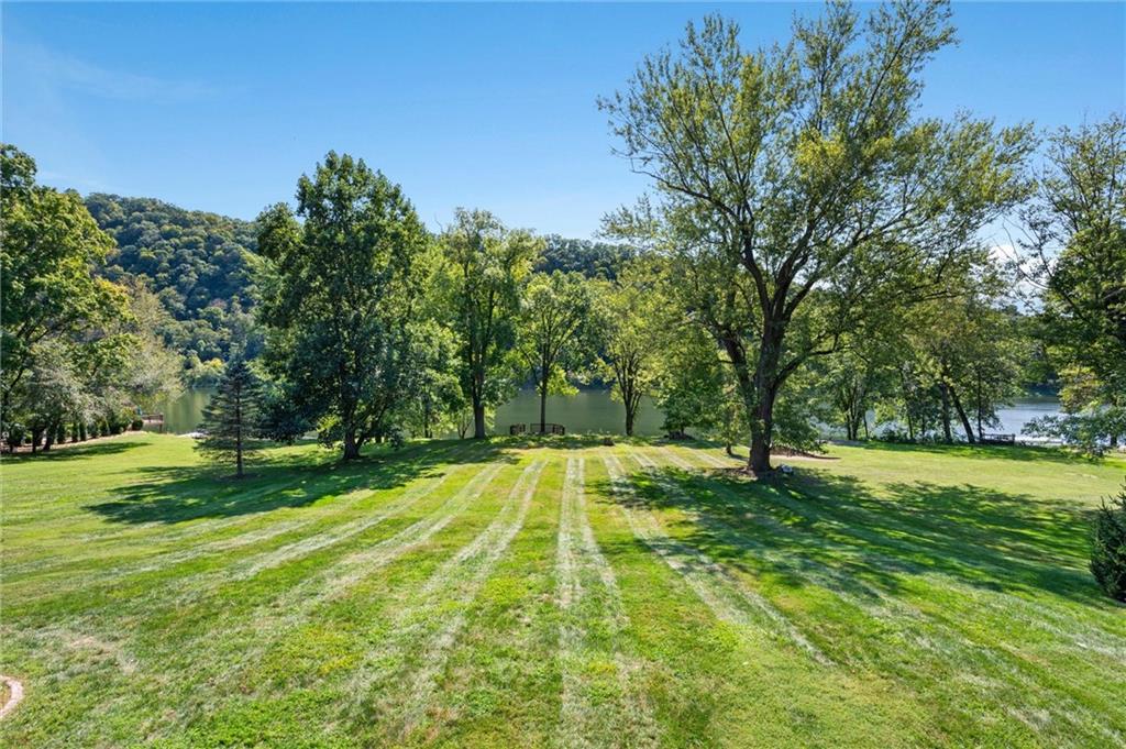 1164 River Road Freeport, PA 16229 - Photo 7 of 50 a swimming pool with trees in the background