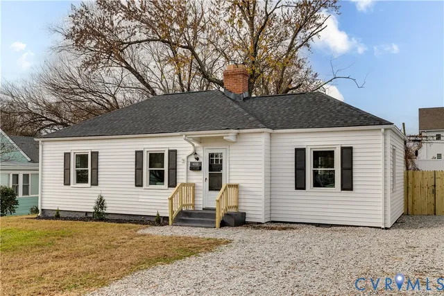 a house that has a tree in front of it
