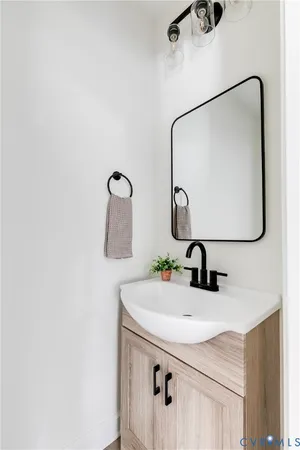 a bathroom with a sink and mirror