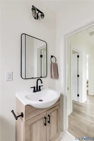 a bathroom with a sink and mirror