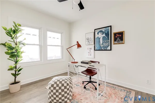 a workspace with furniture and window