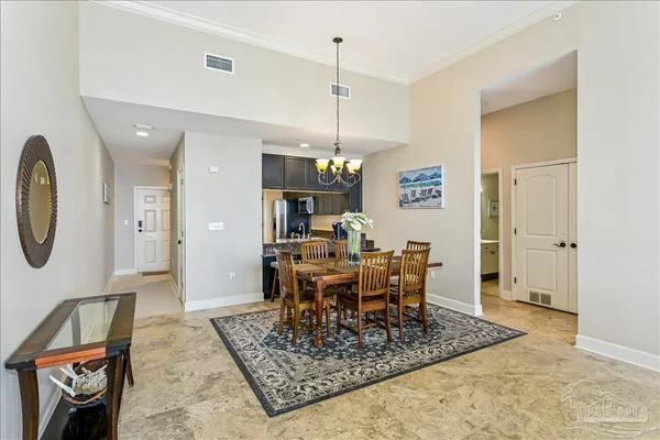 a kitchen with kitchen island granite countertop wooden cabinets and a granite counter tops